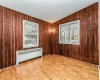 Bedroom with period wood clapboard.