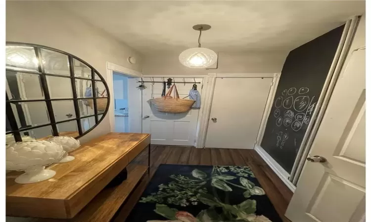 Mudroom with dark wood-type flooring