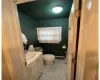 Bathroom featuring vanity, tile patterned floors, and toilet