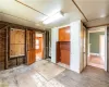 Spare room featuring wooden walls and hardwood / wood-style flooring