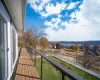 Living/Dining room with view. White oak flooring, floor to ceiling windows.