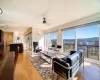 Kitchen with view, decorative light fixtures, a center island and plenty of natural light.