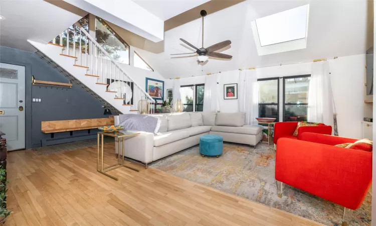 Other view of living room, with stairs going to second floor