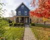 View of front of house featuring a porch and a front yard