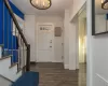 Foyer entrance featuring dark wood-type flooring