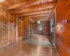 Empty room featuring light wood-type flooring, wood ceiling, and wood walls