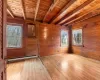 Empty room with light wood-type flooring, a wealth of natural light, and a baseboard heating unit