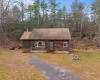 Log cabin with a front yard