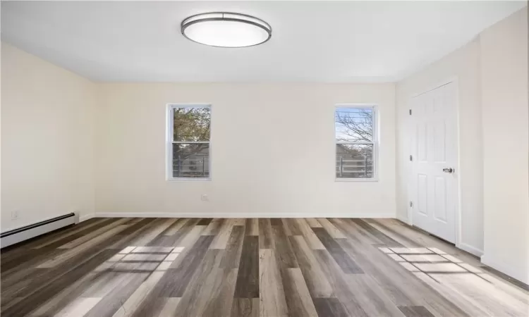 2nd floor unit living room featuring window w/ natural light