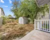 backyard w/ a patio area, & storage shed