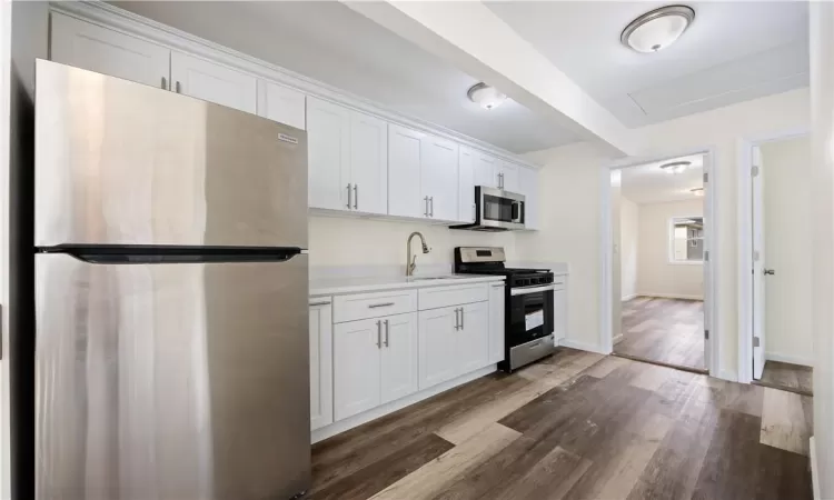 Kitchen w/ crispy white cabinets, stainless steel appliances, 2nd Floor unit