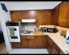 Kitchen featuring white appliances