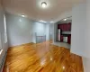 Unfurnished living room with a baseboard radiator and light wood-type flooring