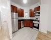 Kitchen featuring stainless steel appliances, light hardwood / wood-style floors, and sink