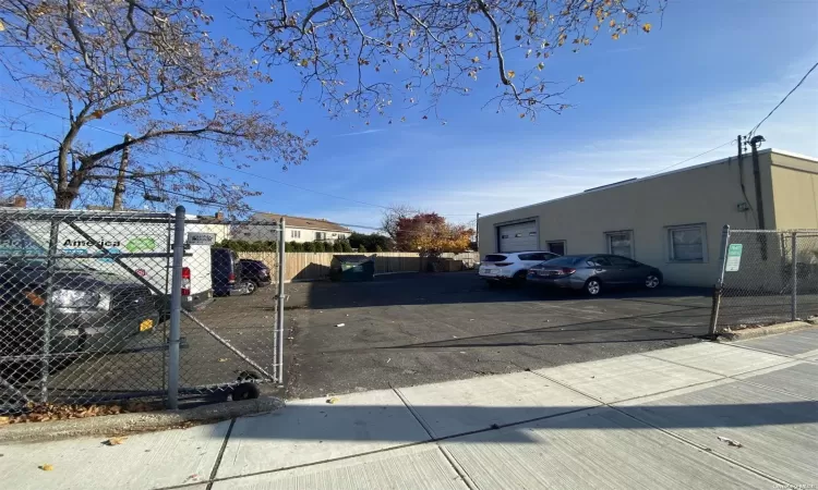 Gated Side Parking W/ Roll Up Door