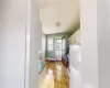 Kitchen featuring white cabinetry and white fridge