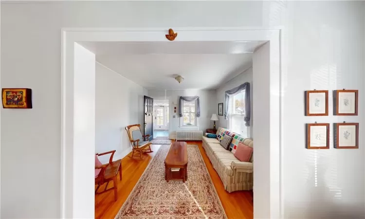 Living room featuring light hardwood / wood-style flooring and radiator