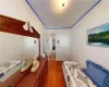 Bedroom featuring hardwood / wood-style flooring and crown molding