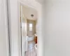 Bathroom featuring tile patterned flooring, tiled shower / bath, toilet, and radiator