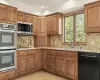 No need to get frantic in this Kitchen, with new double oven, new dishwasher, new microwave and refrigerator  with ice/water dispenser. ! And let's not forget the beautiful 4 burner gas cooktop.