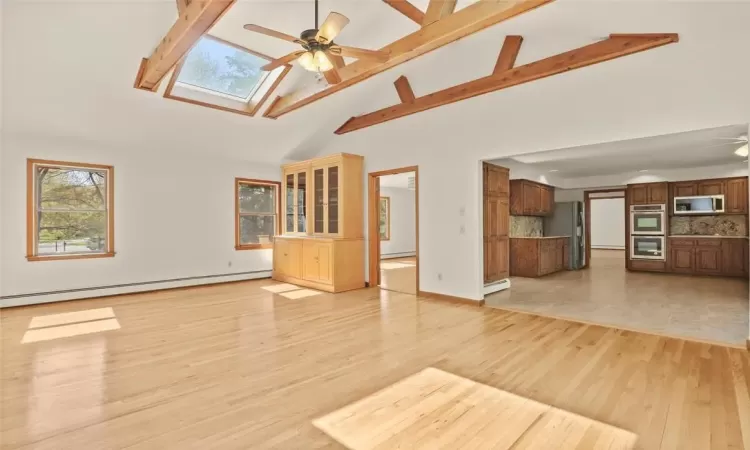 Sun-drenched Family Room open to Kitchen/Breakfast area.