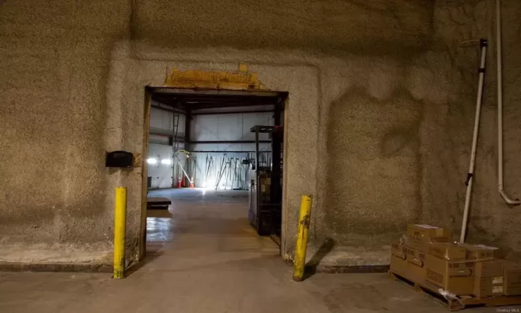 Hallway with concrete flooring