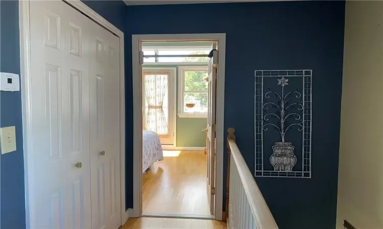 Hallway leading to bright & airy master bedroom w/walk in closet.