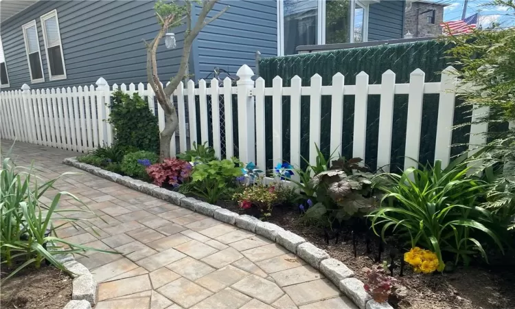 Beautifully done patio(2022) with perennial flowers throughout.