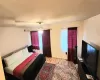 Bedroom featuring ceiling fan, light hardwood / wood-style floors, and a textured ceiling