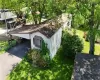 View of front of house with a front lawn and a carport