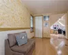 Sitting room with hardwood / wood-style floors