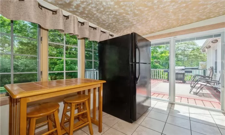 Dining space featuring tile floors