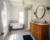 Bathroom with ceramic tile flooring and vanity