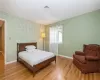 Bedroom with hard wood flooring