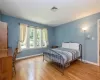 Bedroom with light hardwood / wood-style flooring