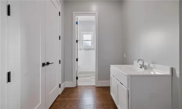 Bathroom featuring wood-type flooring and vanity