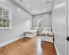 Bedroom with wood-type flooring and multiple windows