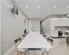 Tiled dining room with sink