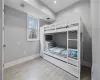 Unfurnished bedroom featuring light wood-type flooring