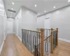 Hallway with light hardwood / wood-style floors