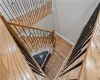 Stairway with hardwood / wood-style floors