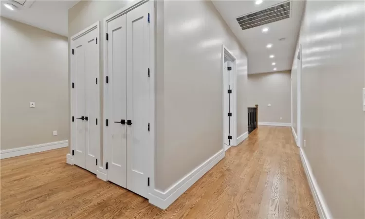 Corridor featuring light hardwood / wood-style flooring