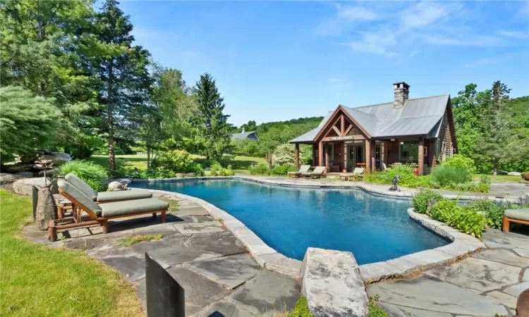 View of pool featuring patio area