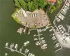 Birds eye view of property with a water view