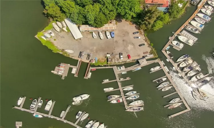 Birds eye view of property with a water view