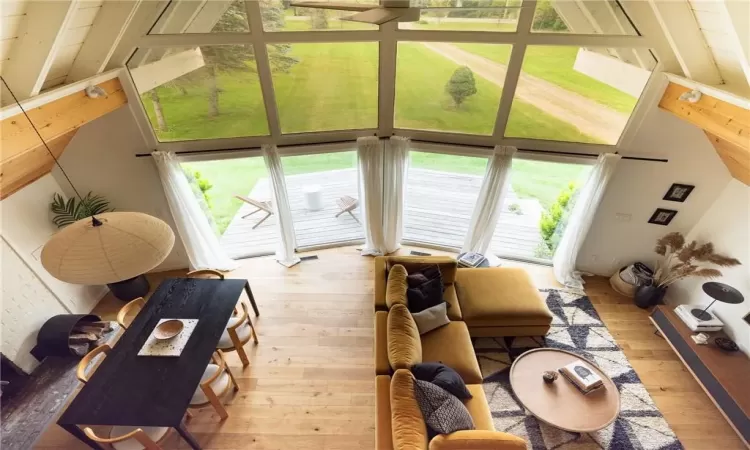 Living room featuring light hardwood / wood-style flooring and a wealth of natural light