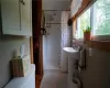 Master Bathroom with tile floors and a shower with shower curtain