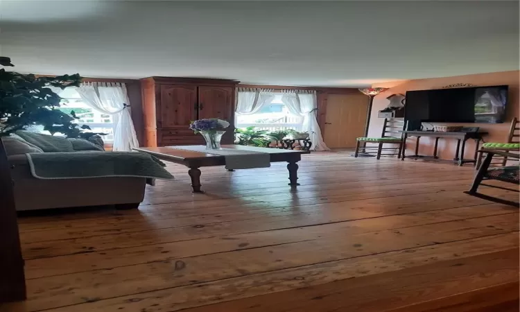 Living room with hardwood / wood-style floors