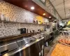 Kitchen with tasteful backsplash and tile floors