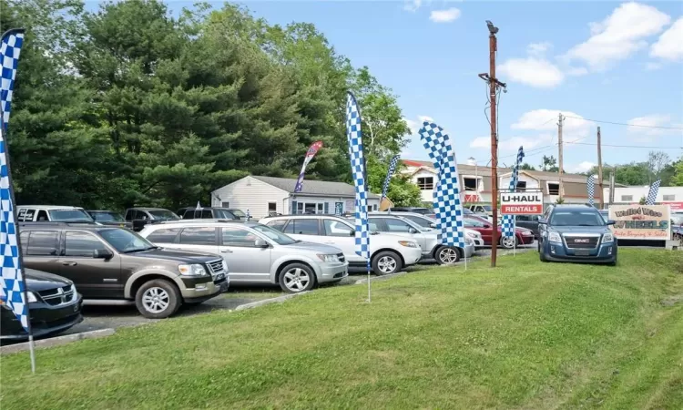 View of car parking with a yard